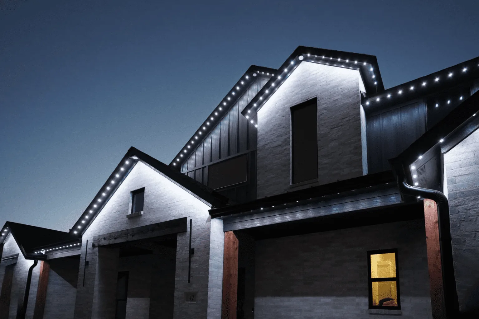 Cool White permanent LED lighting on a Hope area home